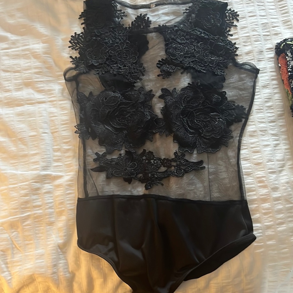 Laced black bodysuit, it’s size M but it wears small
